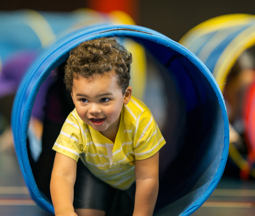 Image of child in play tunnel at David Lloyd Clubs