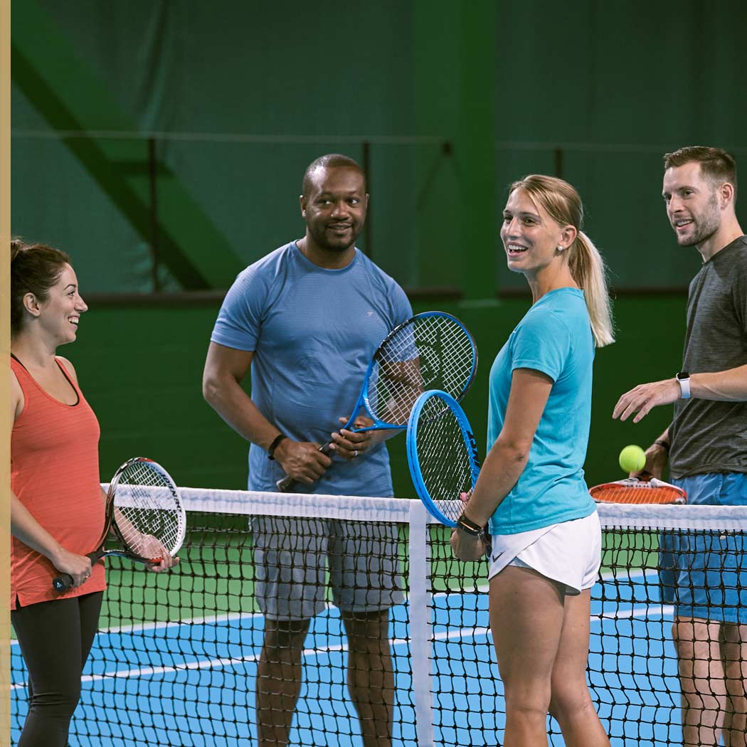 Image of group playing tennis at Harbour Club